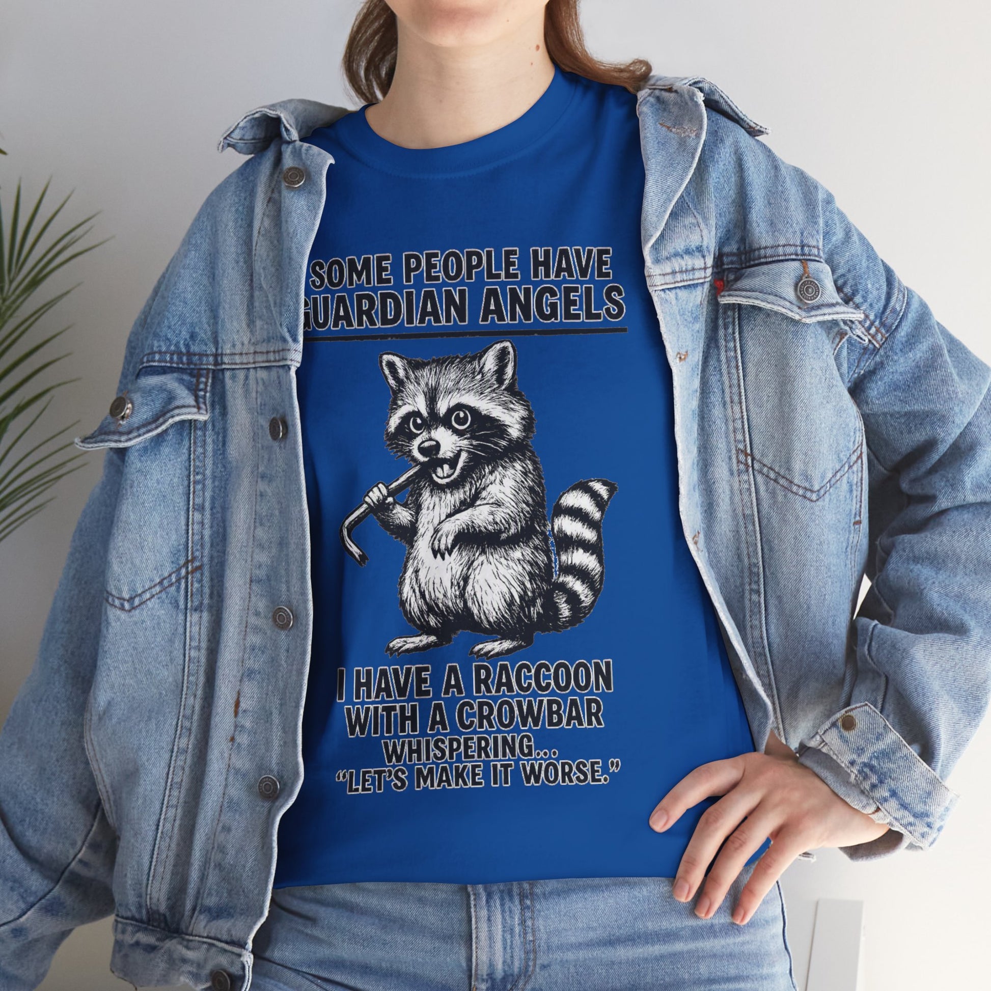 Raccoon with crowbar graphic T-shirt by Printify, featuring the quote "Some People Have Guardian Angels."
