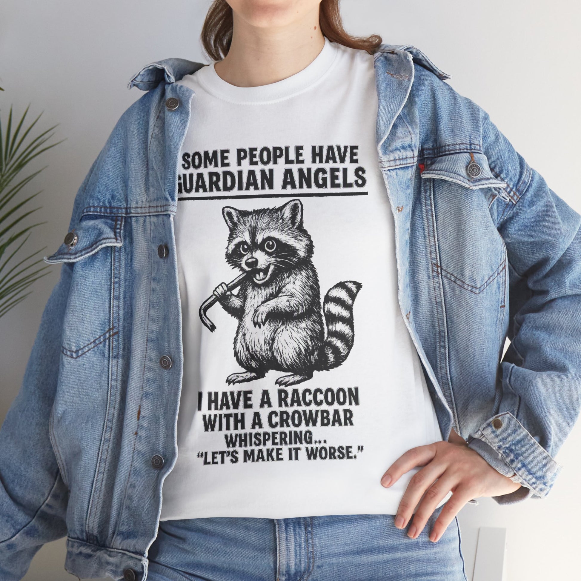 Raccoon with crowbar graphic T-shirt by Printify featuring "Some People Have Guardian Angels" slogan on a casual fabric tee.