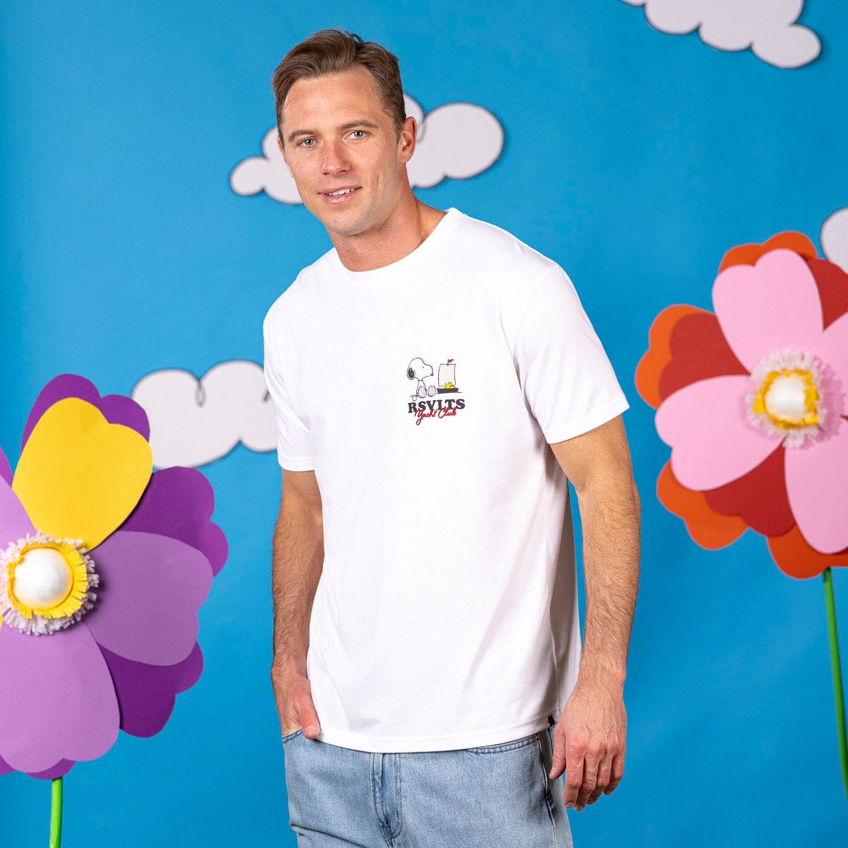 Peanuts "Sailin' Away" crewneck T-shirt by RSVLTS® featuring a nautical Peanuts cartoon design on a navy crewneck tee.